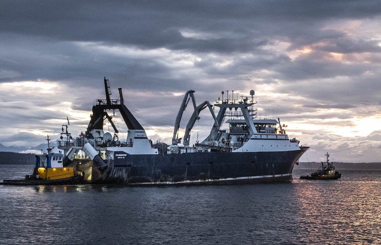 The CP Starbound sails out of the Ballard Locks and into Puget Sound Tuesday, May 12, 2020.  Its crew has gone through Covid testing before sailing out to fish. 213954