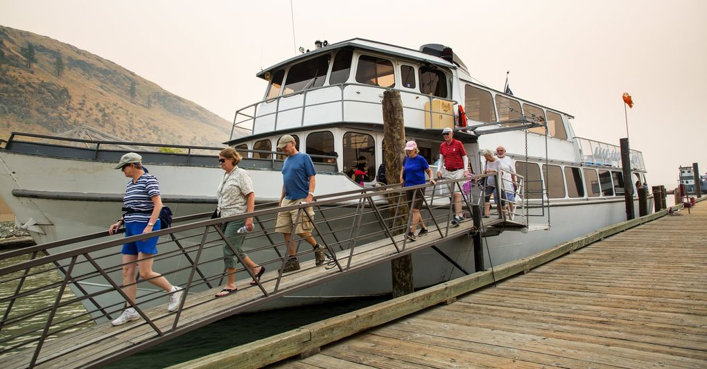 Lady of the Lake II docks along the south shore of Lake Chelan after a day of ferrying passengers between Chelan and Stehekin in this 2017 file photo. The Stehekin Ferry — smaller, newer and a bit sleeker — is opening this summer, offering visitors a second option to get to the tiny lake town. (Mike Siegel / The Seattle Times)
