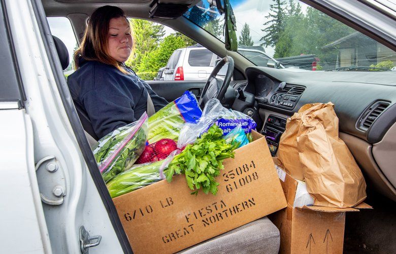 Rebecca Wilber picks up a load of groceries and lunches from Family Promise of Skagit Valley for Grace House, a transitional home for pregnant and new mothers.The food donation was picked up at Family Promise’s Bethlehem Lutheran Church location in Sedro Woolley, Washington. 

Photographed on May 20, 2020.  214016