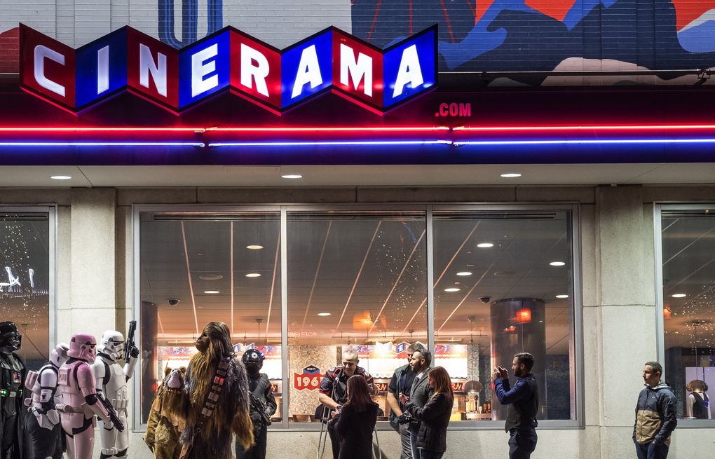 Fans line up at Cinerama movie theater for the 2017 opening of “The Last Jedi.” The popular Seattle cinema has been closed since early 2020. (Dean Rutz / The Seattle Times)