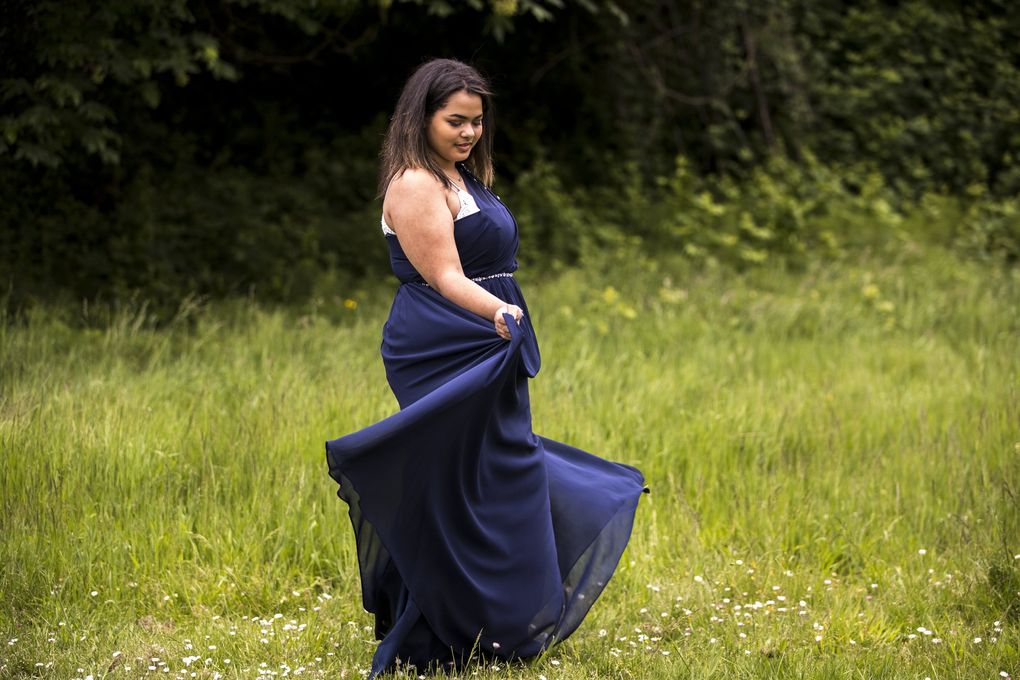 Alyssa White, a senior at Chief Sealth High School, in her would-be prom dress on Wednesday, May 20, 2020. (Amanda Snyder / The Seattle Times)