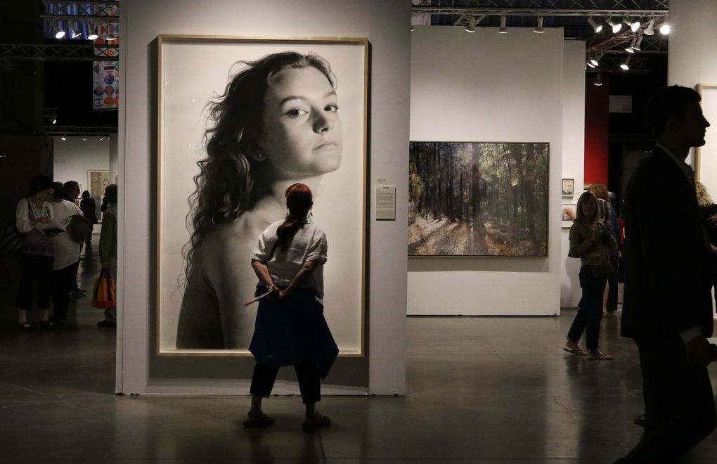 Shown here is a 91-inch charcoal portrait by Clio Newton that was sold by The Forum Gallery at the 2019 Seattle Art Fair, founded by Paul Allen, who was a keen art collector. (Alan Berner / The Seattle Times)