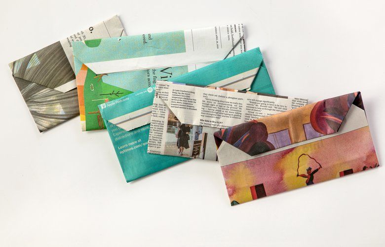Envelopes made from newspaper in New York on May 19, 2020. You may not be able to embrace your friends and family for a while, but letter writing is a great way of letting them know you care from afar. (Tony Cenicola/The New York Times) XNYT86 XNYT86