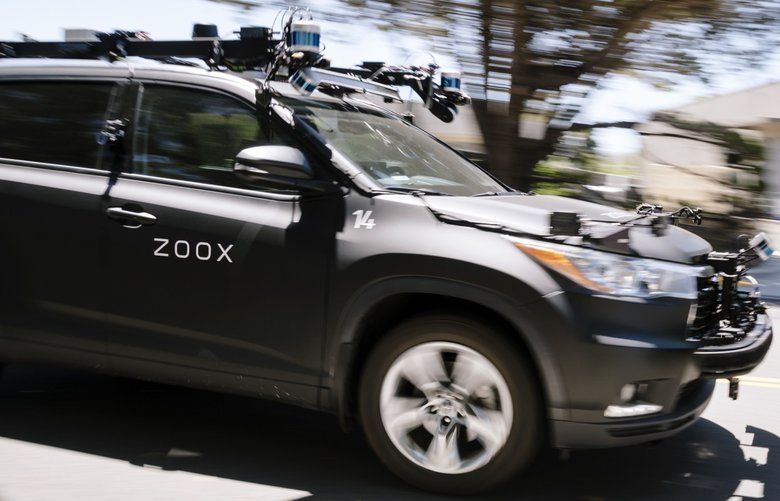 A Zoox Inc. self-driving car is operated outside the company’s headquarters in Foster City, California, U.S., on Wednesday May 27, 2020. Amazon.com Inc.’s talks to buy driverless vehicle startup Zoox Inc. has analysts speculating the deal could save the e-commerce giant tens of billions a year and put auto, parcel and ride-hailing companies on their heels. Photographer: Michael Short/Bloomberg 775516519