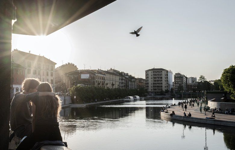 FILE – A couple in Milan, May 4, 2020. As Italy cautiously emerges from lockdown, anxieties have centered on public gatherings of teenagers and young adults – unfairly, some experts say. (Alessandro Grassani/The New York Times) XNYT53 XNYT53