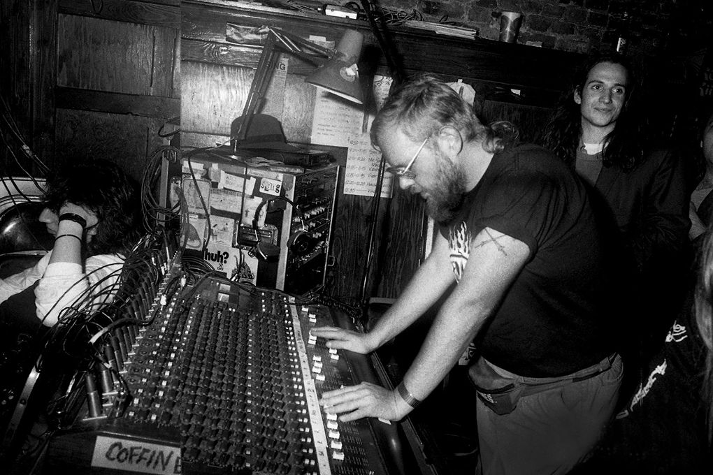 Pearl Jam guitarist Stone Gossard, right, hangs out behind the Central Saloon’s sound board in the early ’90s. (Karen Mason Blair)