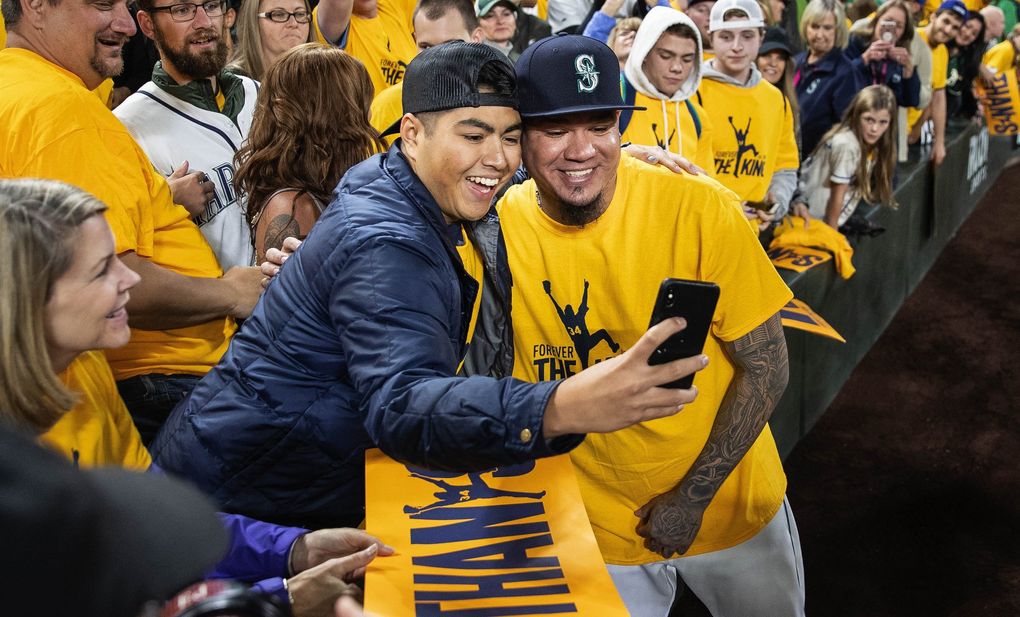 Felix Hernandez take a selfie with Andrew Urrutia in Kings Court following the game on September 26, 2019.(Dean Rutz / The Seattle Times)