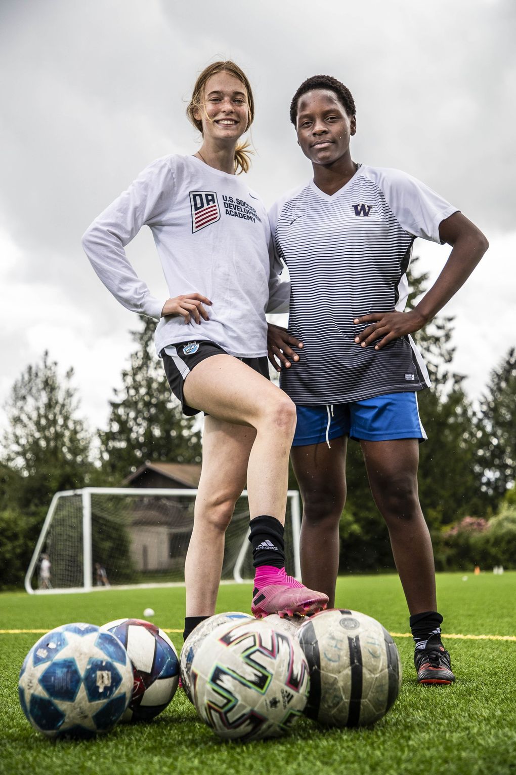 Lughano Nyondo is a 15-year old soccer star in her native Malawi, and she met Ruby Settle in France. Nyondo was visiting Settle in Seattle on her way to accepting a scholarship in Connecticut. But when the pandemic hit she was stuck in Seattle. Settle’s family has taken her in and helped her in continuing her training. (Dean Rutz / The Seattle Times)