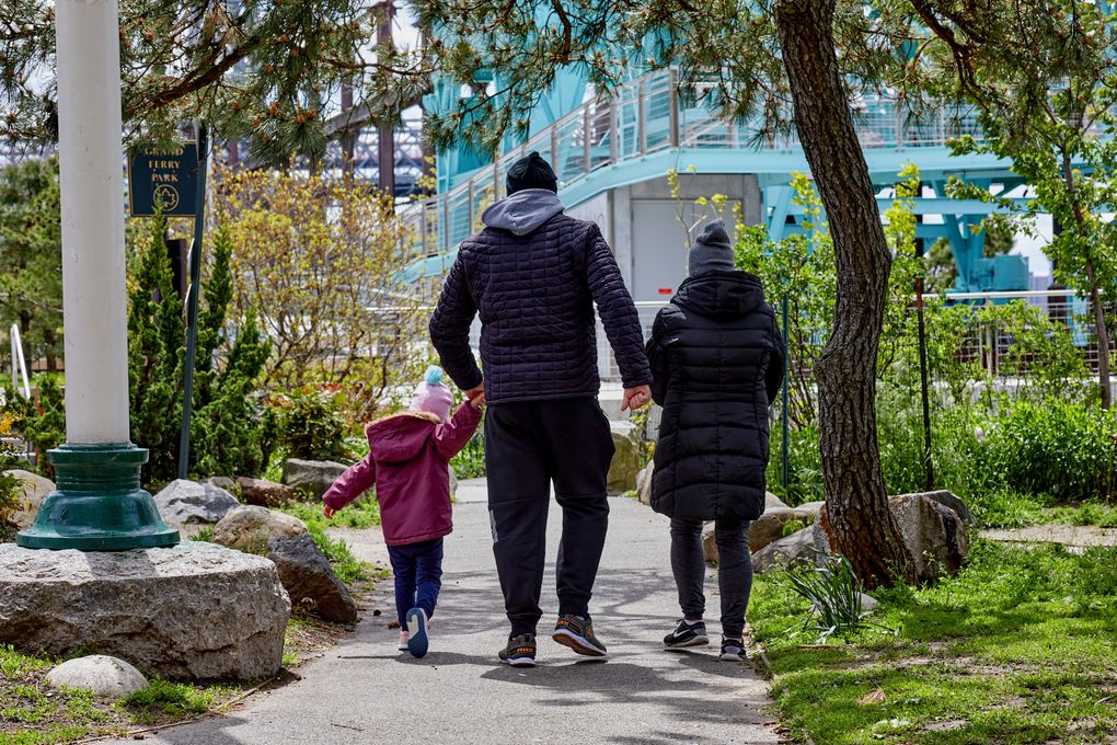 A family walks in Brooklyn, May 9, 2020. The pandemic has separated many grandparents from their grandchildren. (Stephen Speranza / The New York Times)
