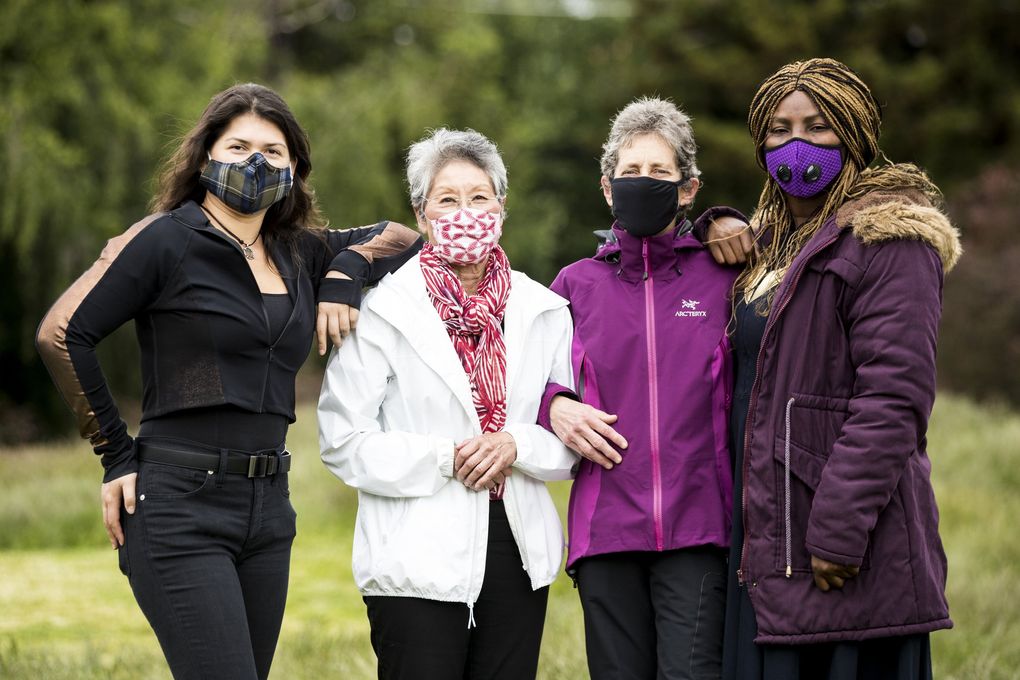 Alexandra Chen, left, Sharon Sakamoto, Muraco Kyashna-tocha and Abie Ekenezar are among the plaintiffs in a lawsuit against the city of Seattle, stating police used “unnecessary violence” in controlling and suppressing crowds at recent demonstrations against racial injustice and police violence on Capitol Hill. (Amanda Snyder / The Seattle Times)