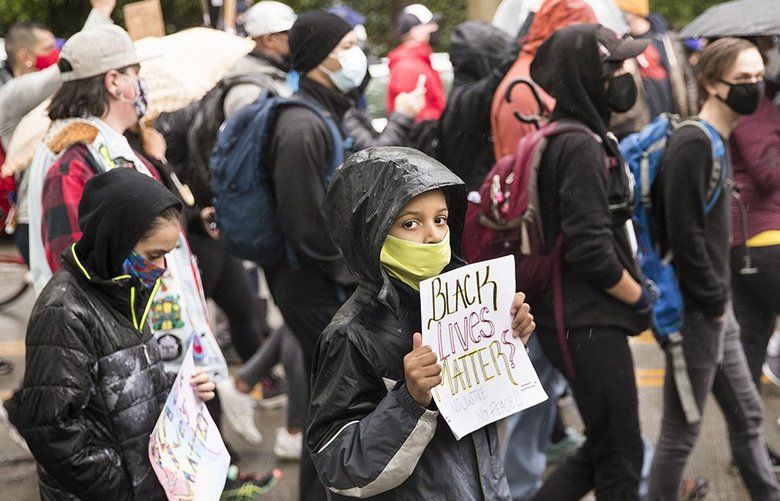 Thousands march in Seattle — in silence — to show support of Black ...