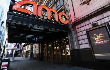 FILE – In this May 13, 2020 file photo, AMC Empire 25 theatre appears on 42nd Street in New York. The nationâ€™s largest movie theater chain changed its position on mask-wearing less than a day after the company became a target on social media for saying it would defer to local governments on the issue. AMC Theaters CEO Adam Aron said Friday that its theaters will require patrons to wear masks upon reopening, which will begin in July. (Photo by Evan Agostini/Invision/AP, File) NYET531 NYET531