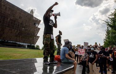 Protestors rally at the National African American Museum of History and Culture on June 6. MUST CREDIT: Phot for The Washington Post by Evelyn Hockstein