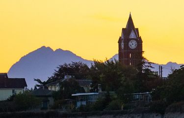 The Olympic Mountains loom behind the Jefferson County Courthouse in Port Townsend during a recent sunset. 

Port Townsend, about an hours drive from the Kingston Ferry terminal, is a small town that features sweeping views of both the Olympic and Cascade Mountain Ranges. 

Photographed on September 4, 2019.  211245