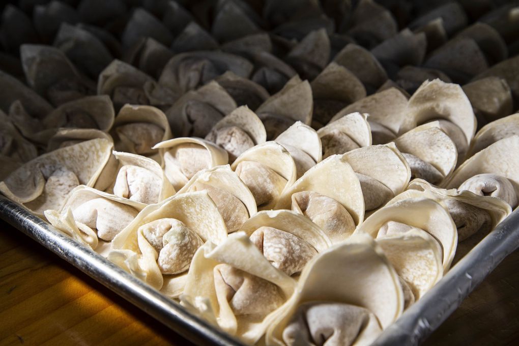 A tray of frozen wonton noodles awaits a hungry public at Dumpling the Noodle in Wallingford. (Dean Rutz / The Seattle Times)