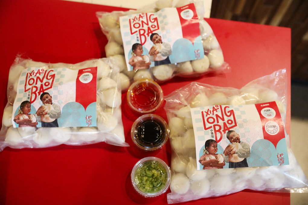 XCJ (Xiao Chi Jie) frozen soup dumpling orders include dipping sauces (from top: chili oil, vinegar, ginger-scallion-umami), Monday, May 18, 2020 in Bellevue. (Ken Lambert / The Seattle Times)