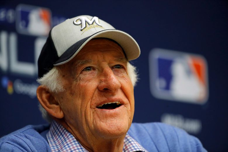Bob Uecker, reporters get a beer shower during Brewers celebration