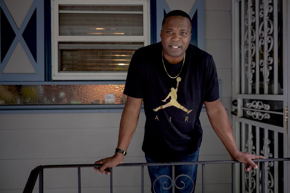 Walter Bailey poses for a photo outside his house in Portland on June 20. “My home is my safe place,” he said. (Christena Dowsett / Special to The Seattle Times)
