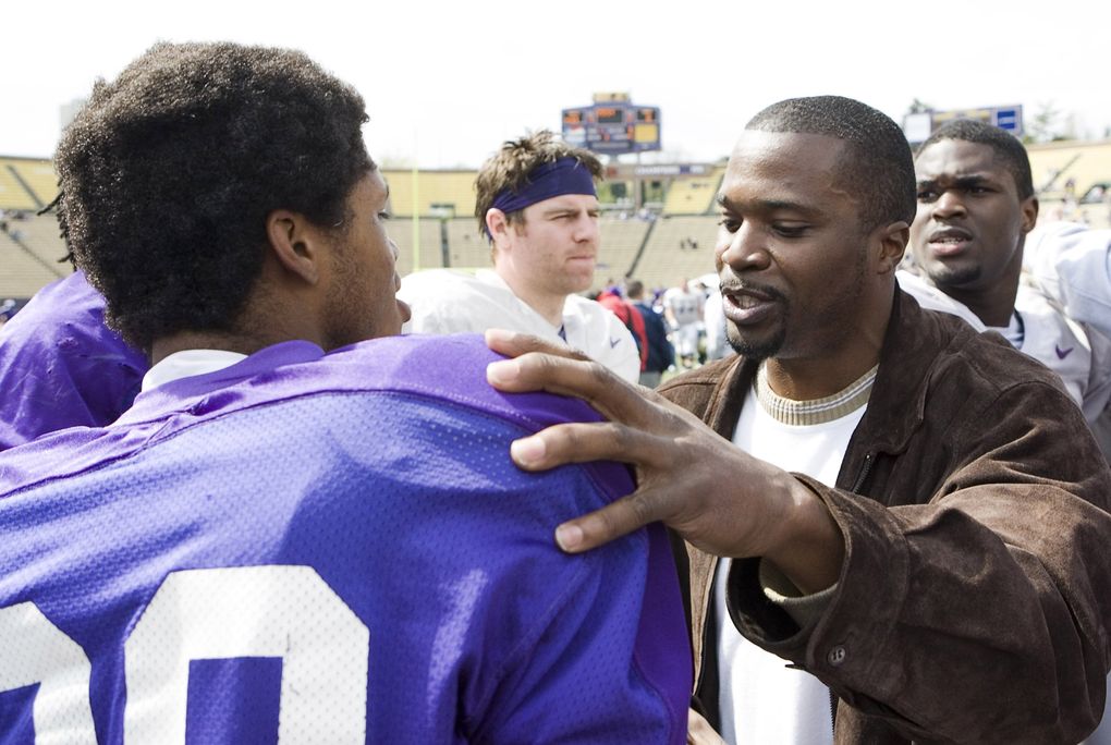 Walter Bailey, right, a member of the University of Washington’s 1991 national championship football team, talks with cornerback Marquis Persley after the UW spring football scrimmage at Husky Stadium on April 25, 2009. (Stephen Brashear / AP)