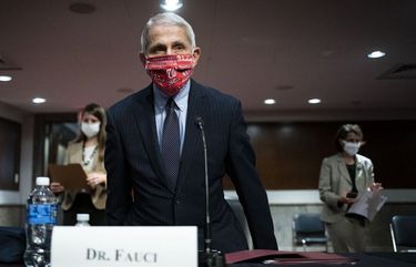 Dr. Anthony Fauci arrives to a Senate Committee hearing on Tuesday, where he warned coronavirus cases could grow to 100,000 a day in the U.S. if Americans don’t start following public health recommendations. (Bloomberg)