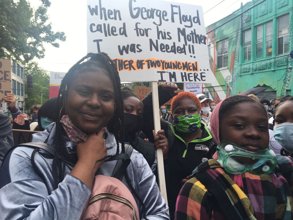 From left: Mi’Qwean Campbell, 18, Mejia Austin, 41, Mildred Austin, 60 and Nigeria Gates, 11, at a protest near the East Precinct on Monday, June 8, 2020. (Sydney Brownstone / The Seattle Times)