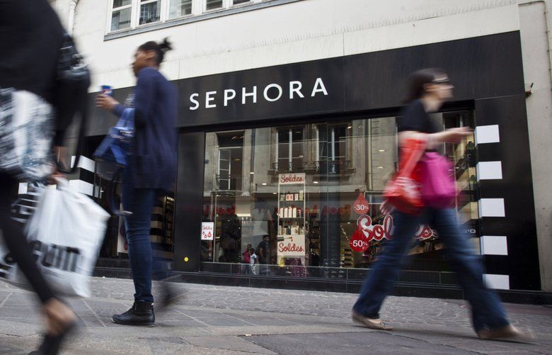 Pedestrians pass a Sephora SA store in Paris, France, on Saturday, June 30, 2012. (Balint Porneczi/Bloomberg