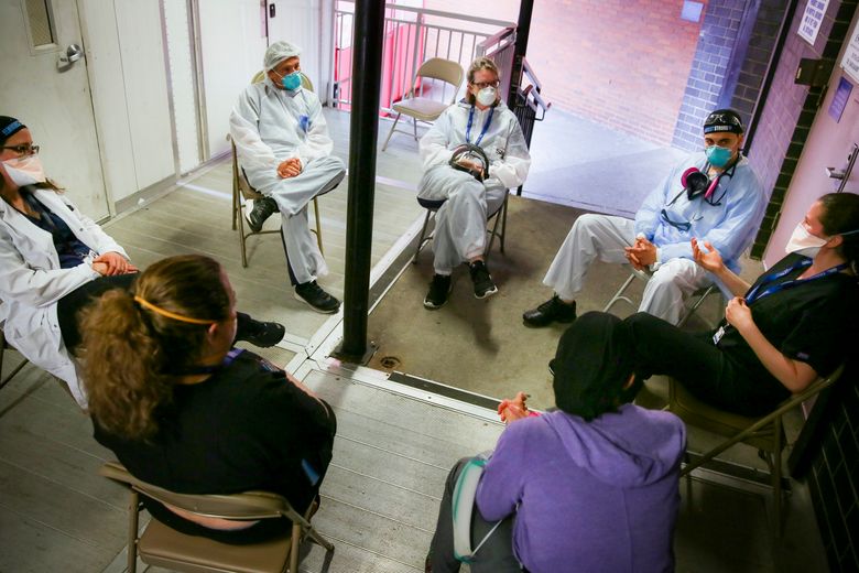 https://images.seattletimes.com/wp-content/uploads/2020/06/urn-publicid-ap-org-8a490dd827bc37a655dd4c0f8a133253Virus_Outbreak_Healing_Health_Workers_06343.jpg?d=780x520