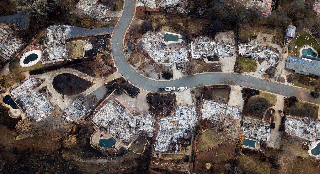 In this Dec. 3, 2018, file photo, homes leveled by the Camp Fire line Valley Ridge Drive in Paradise, Calif. Pacific Gas & Electric was blamed in a series of horrific wildfires ignited by its long-neglected electrical grid. (AP Photo / Noah Berger, File)