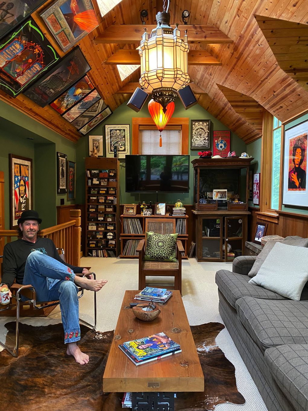 Warner Munro, of Portland, in his version of a man cave, which he calls his “music room.” It features 50 framed posters of the some 200 that he owns, many of which he bought or were framed at Innervisions Posters & Framing. He first stopped by in the mid-1990s, when he spotted an original Grateful Dead poster. (Courtesy of Warner Munro)