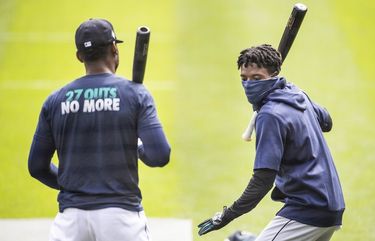 Dee Gordon, right, talks mechanics of hitting with Kyle Lewis.

The Seattle Mariners held the second day of workouts at T-Mobile Park Saturday, July 4, 2020. 214375