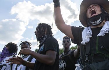 A BLM/LGBTQ marcher shouts back at counter-protesters during a march in Marion, Va., Friday, July 3, 2020. (Andre Teague/Bristol Herald Courier via AP) VABRI102 VABRI102