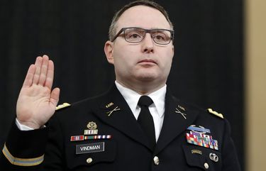 FILE – In this Nov. 19, 2019, file photo National Security Council aide Lt. Col. Alexander Vindman is sworn in to testify before the House Intelligence Committee on Capitol Hill in Washington. Vindman, who played a central role in President Donald Trumpâ€™s impeachment case, announced his retirement from the army July 7, 2020, in a scathing statement that accused the president of running a â€œcampaign of bullying, intimidation, and retaliation.â€(AP Photo/Andrew Harnik, File) WX102 WX102