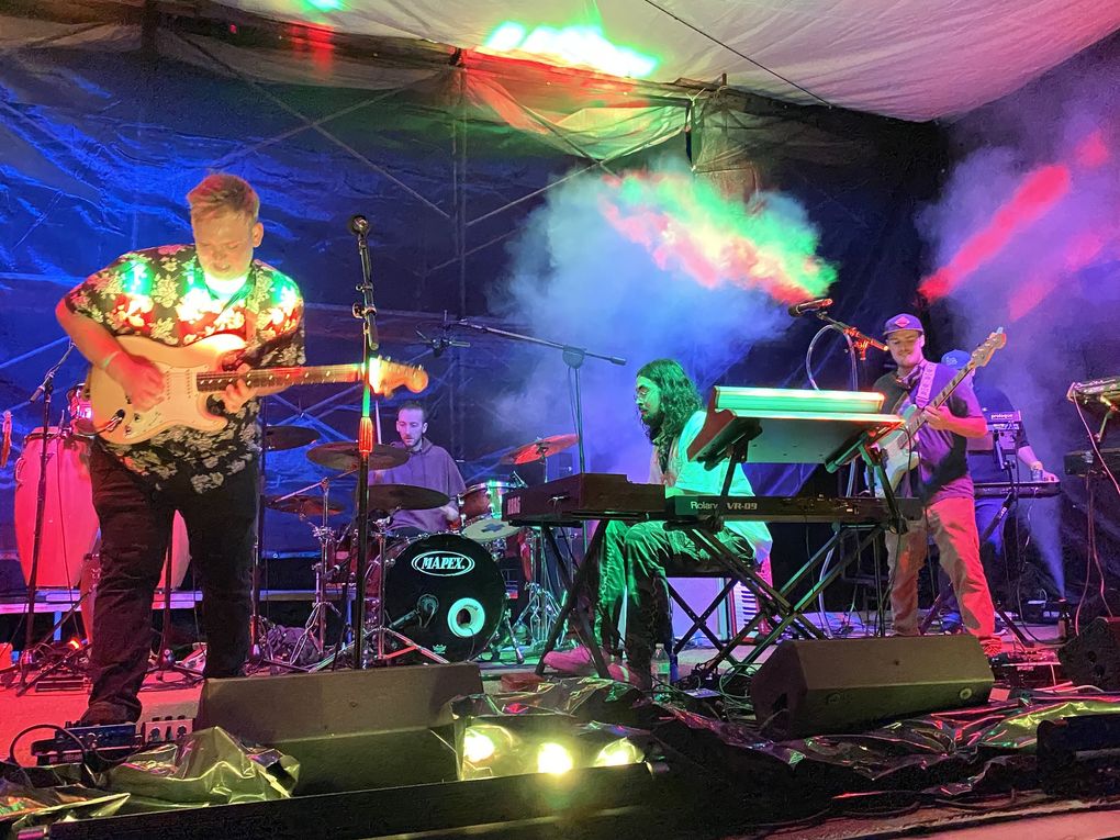 Seattle jam-funk octet Cytrus headlined the July 11 concert, which broadcast the music through FM radio as fans listened from their cars. “It’s something new for everybody involved,” said guitarist Jared Squires, left. (Michael Rietmulder / The Seattle Times)