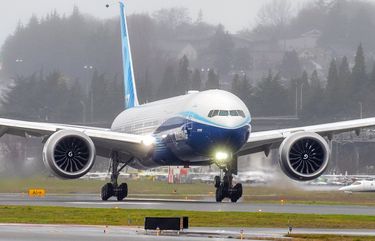 A Boeing 777X lands at Boeing Field in Seattle after its first flight on January 25, 2020. The 777X features giant carbon-composite wings, the largest Boeing has ever designed. The wings are so long that to fit at standard airport gates, each has to fold upward on a hinge 11 feet from the tip.
The new jet is powered by the GE9X engine.

Photographed on January 25, 2020.  212736