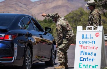 U.S. Army personnel guide residents to a drive-thru Covid-19 testing site at Nations Tobin Recreation Center in El Paso, Texas, on July 15, 2020. MUST CREDIT: Bloomberg photo by Joel Angel Juarez.