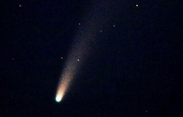The comet Neowise is seen in the northern sky, about 20 degrees above the horizon, from Alki Beach in West Seattle Wednesday night. The comet has been visible recently from the northern hemisphere, even from light-polluted urban areas like Seattle, and can now be spotted to the northwest just below the Big Dipper about an hour after sunset. The National Weather Service predicts mostly clear skies Friday night over the Puget Sound region after the morning clouds and rain dissipate, but some areas along the coast and near the Cascade Mountains might still see lingering cloud coverage Friday night.
Astronomers first discovered the comet in late March, using the Near-Earth Object Wide-Field Infrared Survey Explorer telescope, according to Scientific American. Officially named C/2020 F3, it has been informally dubbed Neowise, after the acronym for the instrument that spotted it.
The comet will come closest to Earth — a mere 64 million miles away — on July 22. After this appearance, Neowise isn’t expected to be near Earth again for about 6,800 years.
This image was made with a 400mm telephoto lens mounted on a tripod using a 1.3-second exposure, at f8, and ISO 10,000.
12929177
LO LO 214519 214519