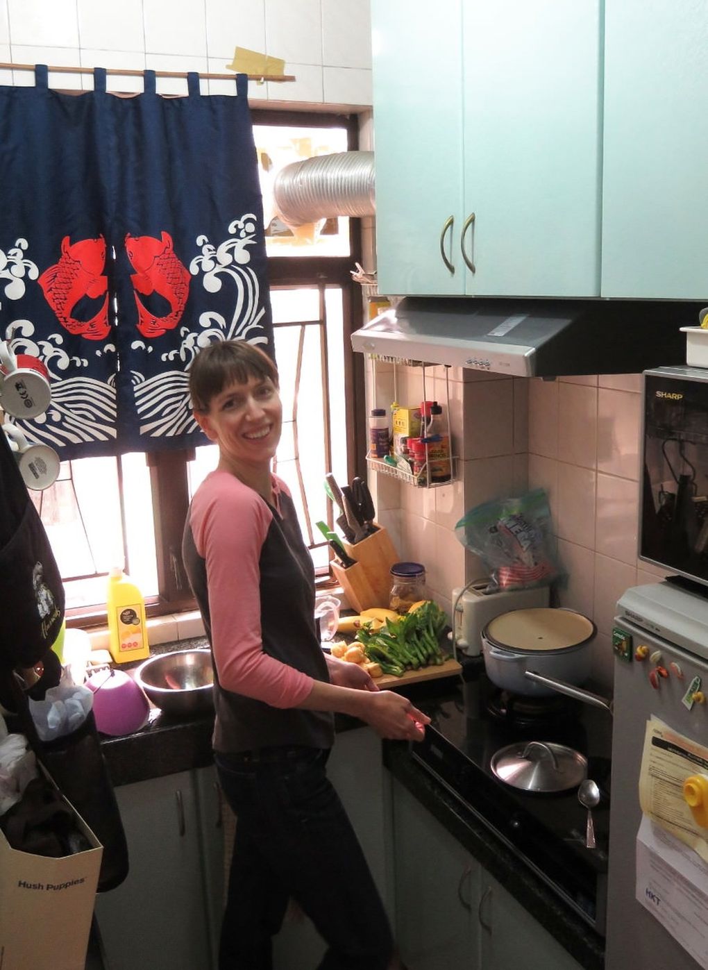 Micaela Ellison has traveled widely. Here, she is pictured cooking in a kitchen in Hong Kong during a visit there in 2018. (Courtesy of Micaela Ellison)