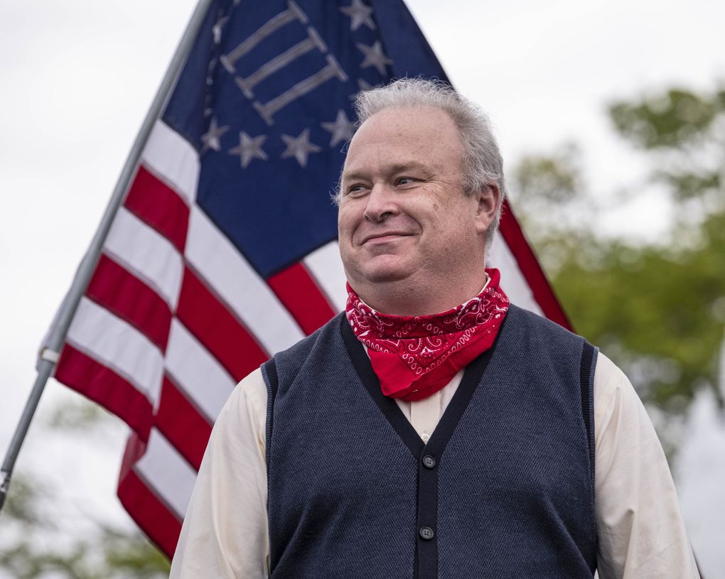 State Rep. Jim Walsh (R-Aberdeen) addresses the crowd at the Capitol April 19, 2020. (Dean Rutz / The Seattle Times)