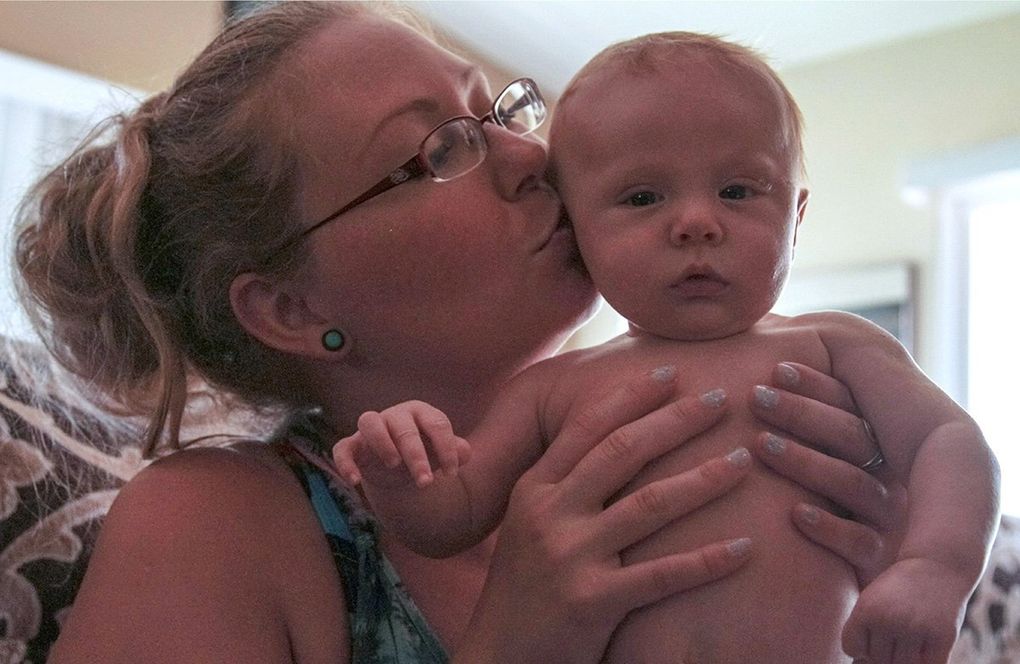 Tamara Loertscher with her infant son. Loertscher was arrested and jailed during her pregnancy after disclosing prior drug use to a physician. (Courtesy of Rosalie Miller)