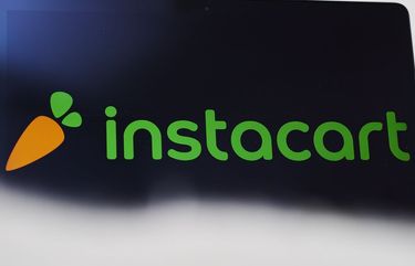 The logo for the Instacart Inc. application is displayed on an Apple Inc. laptop computer in an arranged photograph taken in the Brooklyn borough of New York, U.S., on Friday, April 10, 2020. Across the country, millions of consumers are turning to Instacart and other services to fill their fridges via online delivery rather than brave going to a supermarket because of shelter-in-place declarations during the coronavirus pandemic. Photographer: Gabby Jones/Bloomberg 775504458