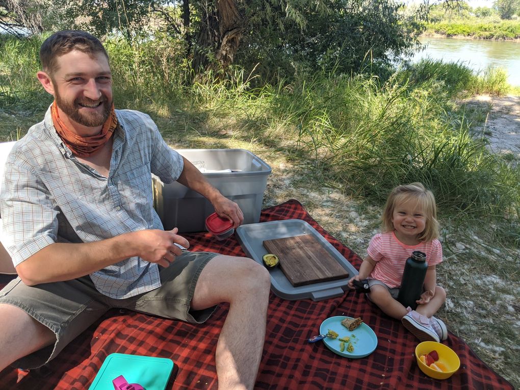 Dan Hutchinson and his daughter Nova enjoy a picnic during a lunch stop on their recent 1,500-mile road trip. (Jackie Varriano / The Seattle Times)