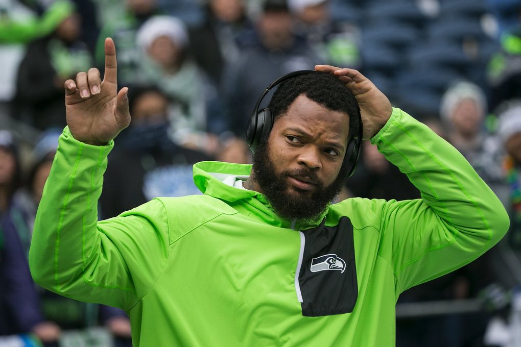 Seattle Seahawks defensive end Michael Bennett acknowledges the crowd Dec. 24, 2016, at CenturyLink Field. (Johnny Andrews / The Seattle Times)