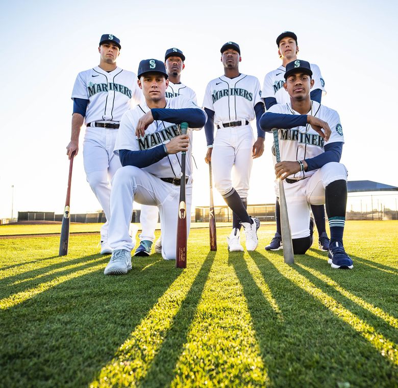 These rookies — left to right (back row) Evan White, Justin Dunn, Kyle Lewis, Logan Gilbert, (front row) Jarred Kelenic and Julio Rodriguez — are the projected core of the Mariners’ rebuild. While a shortened season throws a wrench into the plans, general manager Jerry Dipoto still sees plenty of opportunities for their growth this year. (Dean Rutz / The Seattle Times)
