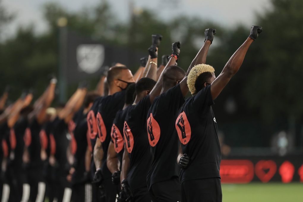 MLS players participate in a Black Lives Matter pregame ceremony before a match between Orlando City and Inter Miami during the MLS is Back tournament at Disney’s ESPN Wide World of Sports in Orlando, Florida, on Wednesday, July 8, 2020. (Mike Ehrmann / TNS)