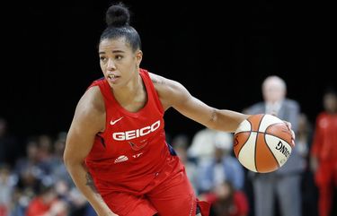FILE – In this Sept. 24, 2019 file photo, Washington Mystics’ Natasha Cloud drives up the court against the Las Vegas Aces during the second half of Game 4 of a WNBA playoff basketball in Las Vegas.  Cloud and her WNBA colleagues continue to be active in the fight against social injustice and police brutality, participating in protests and continuing work that they began four years ago. (AP Photo/John Locher, File) NY151 NY151