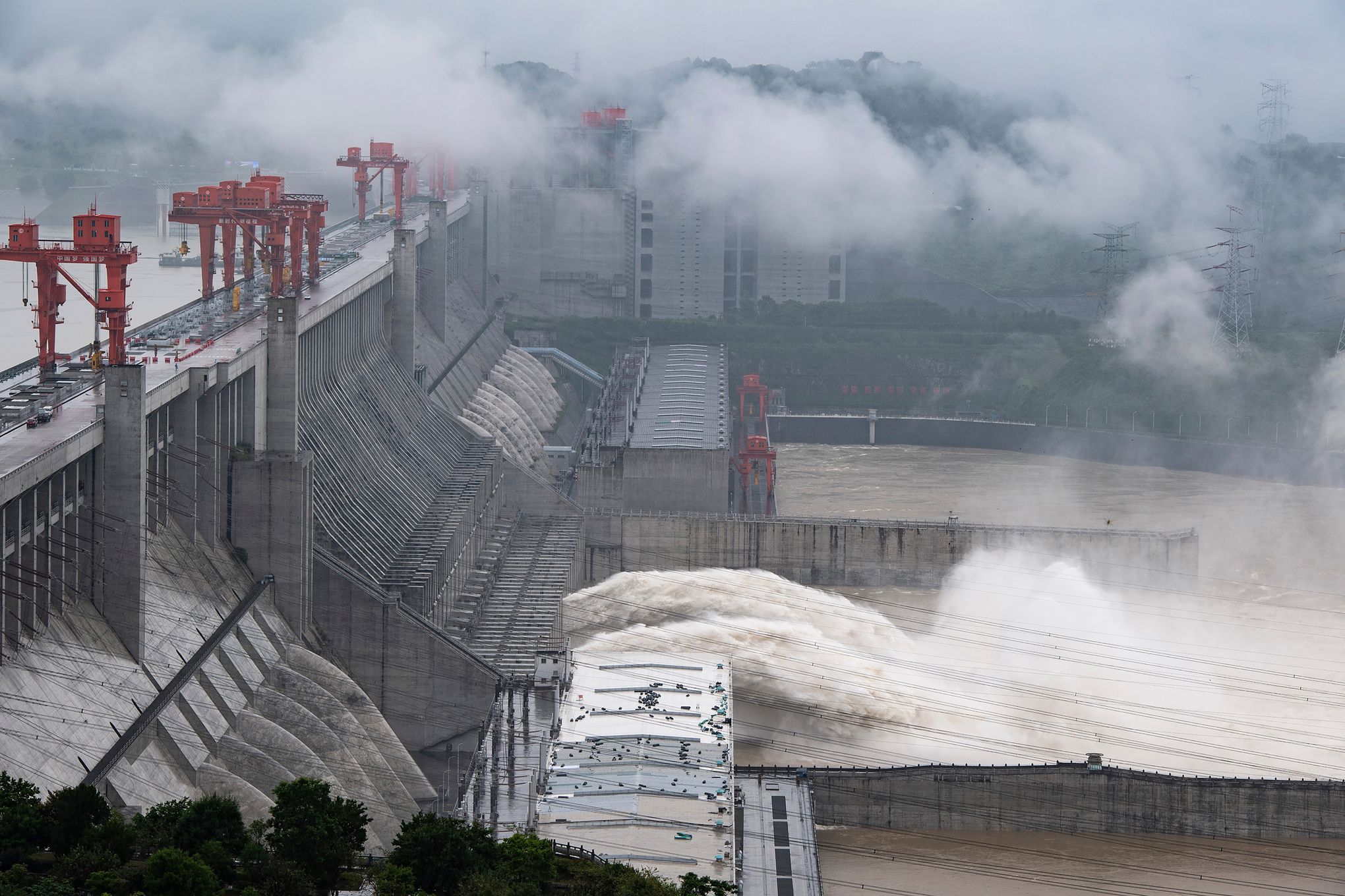 FILE--Floodwaters gush out of the Three Gorges Dam during a flood