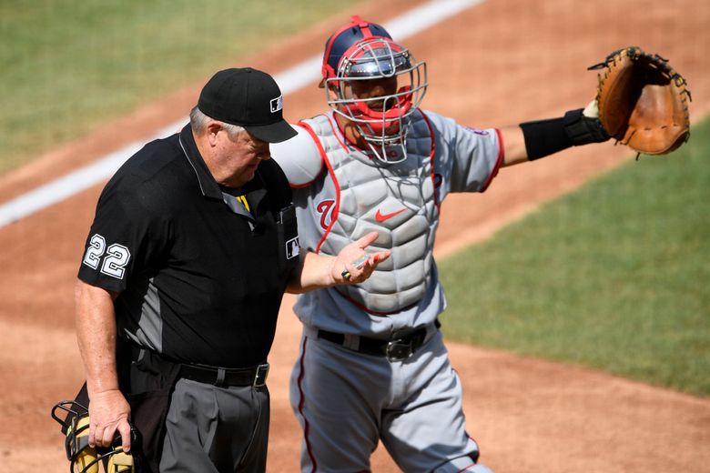Umpire Joe West leaves game after hit by flying baseball bat – The Denver  Post