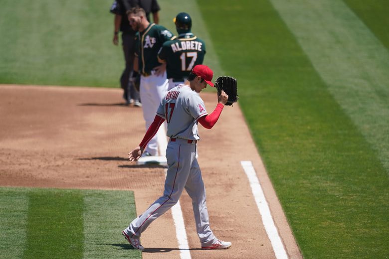 Mark Canha is not pleased with a fastball inside from Shohei