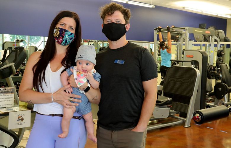 John Carrico with his wife and little girl at their gym, NW Fitness.
From left, Jessica Carrico, Vivienne, 4 mos, and John Carrico.

 214678 (Greg Gilbert / The Seattle Times)