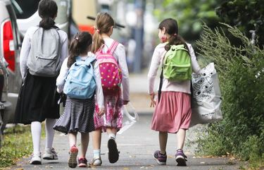 Students with backpacks heading to school in Berlin, Germany, Monday, Aug. 10, 2020. As Germany’s 16 states start sending millions of children back to school in the middle of the global coronavirus pandemic, those used to the country’s famous “Ordnung” are instead looking at uncertainty, with a hodgepodge of regional regulations that officials acknowledge may or may not work. (AP Photo/Markus Schreiber) MSC102 MSC102